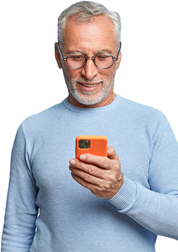 A middle aged male dials a number on his mobile phone